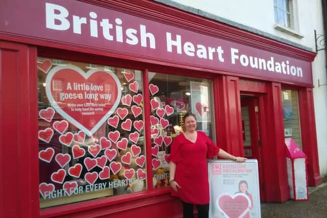 Zoe Nunn at the British Heart Foundation shop in Midhurst, which has a wedding proposal left in the window.