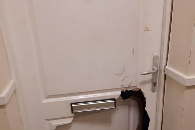 Police broke open the door with a battering ram and crawled through the small opening. Picture: Miles Ockwell/Sussex Police