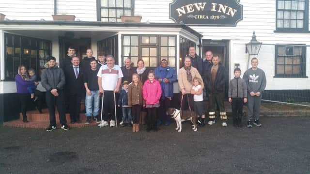 Brett McLean, Sandra Martin, the Lucas family and customers outside the New Inn SUS-180131-151841001