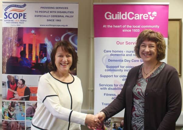 Worthing and District Scope chairman Jacquie Pinney and Guild Care chief executive Suzanne Millard
