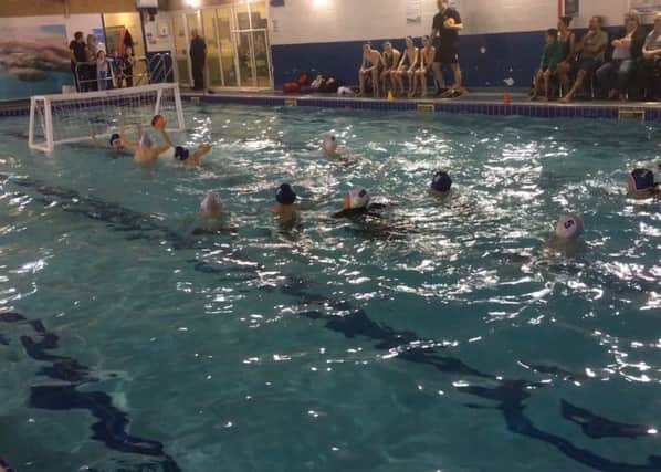 Action from the historic water polo match