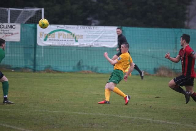 Tony House's chip gives Horsham their second goal against Sittingbourne. Picture by John Lines