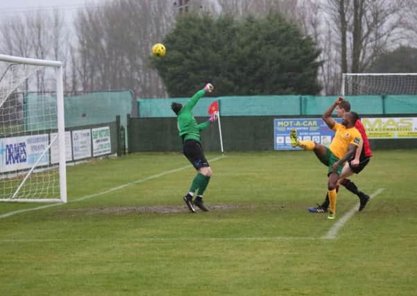 Tony Nwachukwu lift home Horsham's opening goal against Sittingbourne. Picture by John Lines.