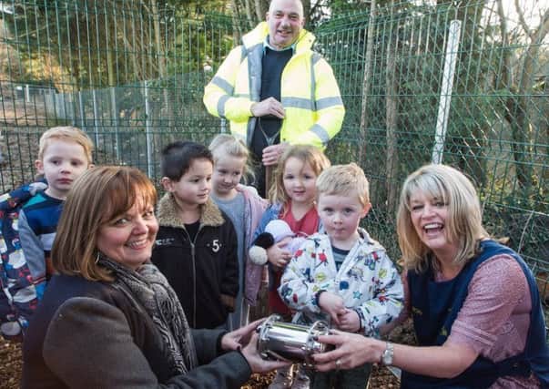 Coralie Thomas, Sharon Rance and children from Thakeham pre-school with the time capsule. Picture: Sophie Ward Photography