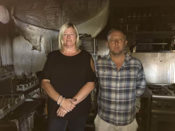 Julie Fear, owner, and chef Stuart Harmer at The Boat House in Littlehampton, where folded linen ignited, sparking a fire