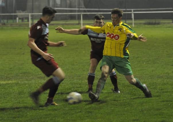 Little Common pair Louis Walker and Liam Ward converge on a Hailsham Town opponent. Pictures by Simon Newstead