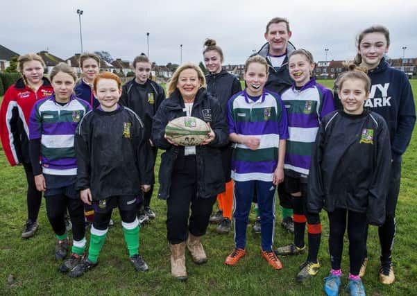 CALA Homes have donated money to Bognor Regis for Women's and Girls rugby facilities at the club. Irene Whitmarsh from CALA Homes seen here with Steve Andrews and girls from the team