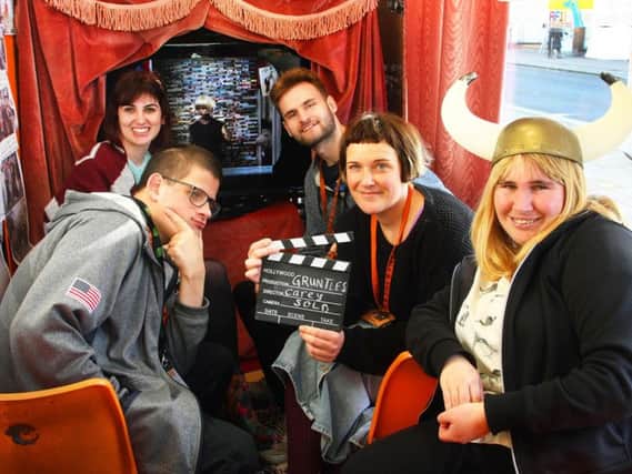 Executive producer Emma Criddle with trainees in the pop-up cinema at the SOLD charity shop in Shoreham High Street. Picture: Derek Martin DM1812632a