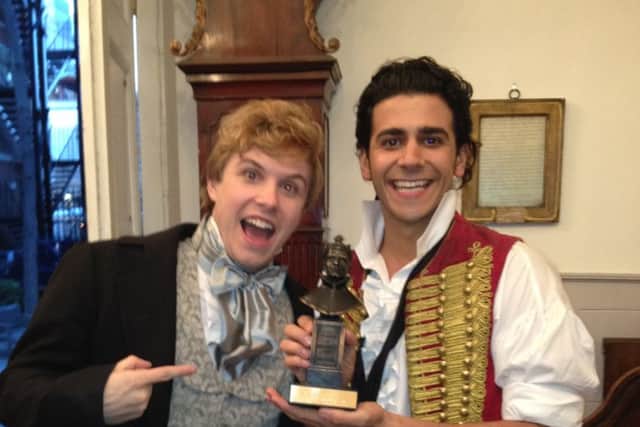 Liam Tamne with an Olivier award for Les Miserables