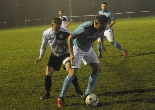 Action from Bexhill United's last home game, the Division One Challenge Cup quarter-final victory at home to AFC Varndeanians, on Tuesday, last week. Picture by Simon Newstead