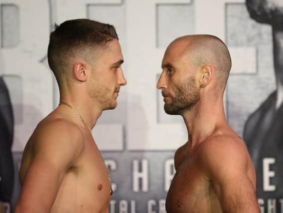 Ben Jones, right, and Reece Bellotti eye each other up at the big show weigh-in yesterday.
Picture by Lawrence Lustig.