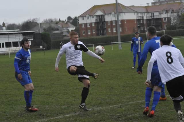 Bexhill United forward Zack McEniry on the ball.