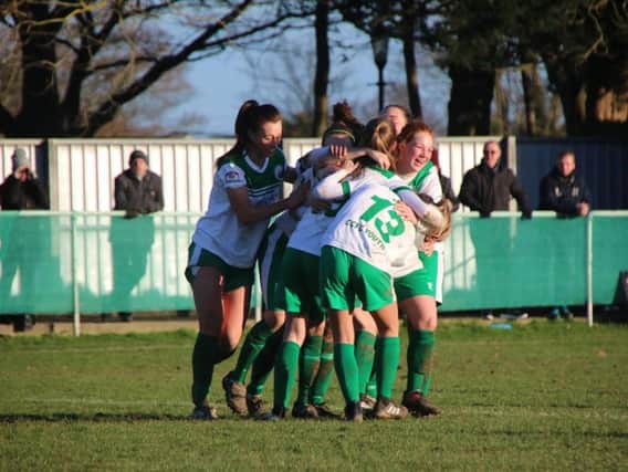 Chi City Ladies celebrate a goal against Luton in an earlier round