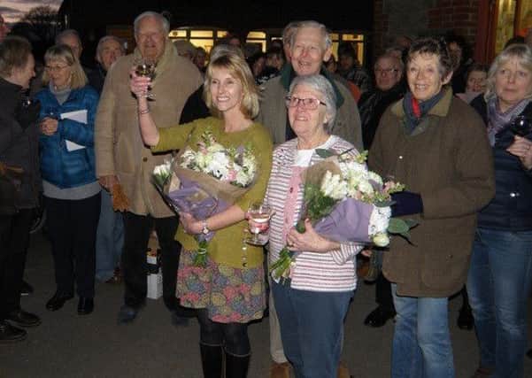 Toasting the Post Office is Lizzie Webber with Glenys Parkhouse, back row Allan Futte and Judith Turner