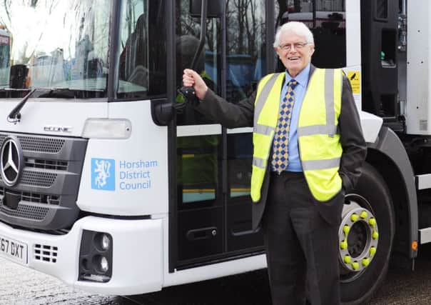Horsham district councillor Philip Circus with one of the district's new waste trucks SUS-180502-143216001