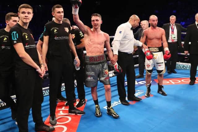 Reece Bellotti raises his hand in victory at the end of his fight with Ben Jones, right.
Picture by Lawrence Lustig/Matchroom Ringside photos and Mark Robinson/Matchroom Backstage photography