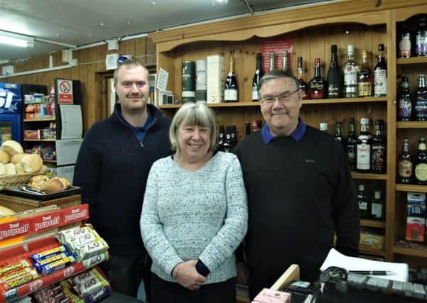 Colin Woods, proprietor of Amberley Village Stores, with manager Lee Stace and postmistress Tina Bishop