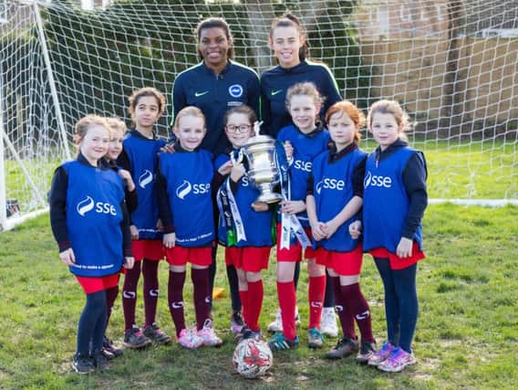Brighton & Hove Albion Women's players Ini Umotong (back, left) and Laura Rafferty (back, right) visited Goring C of E School last Friday.