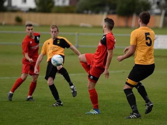 Gary Peters, in action for Littlehampton, netted twice for Rustington as they reached the Sussex Intermediate semi-finals on Saturday. Picture by Phil Westlake (PW Sporting Photography)