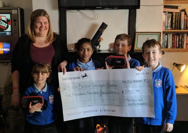 River Beach Primary School in York Road, was the joint recipient of a raffle held at the New Inn in Norfolk Road, Littlehampton. It used the money to buy virtual reality headsets.