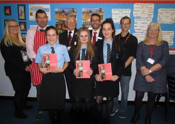 The three winners of the Young Chef Competition (left to right): first, Zoe White; second, Lauren Kilpatrick; and third, Abbey West. Behind are those who assisted and supported: Louise Stewart, teaching assistant; Chris Frampton, teacher of food technology; Jeremy Flaskett, president of West Worthing Rotary Club; Peter Byrne, head teacher; Mark Brocklehurst, of The Empty Plate CafÃ©; and Sue Virgo, youth services officer for Worthing Rotary Club