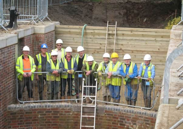 Volunteers at the Wey and Arun Canal Trust at the completed Gennets Bridge Lock.