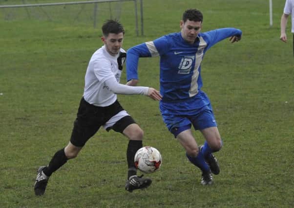 Kyle Holden in the thick of the action during Bexhill United's 2-1 defeat at home to Storrington on Saturday. Picture by Simon Newstead
