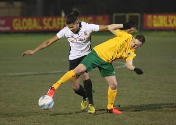 Toby House battles for the ball against a Pagham opponent on Tuesday night. Picture by John Lines.JPG