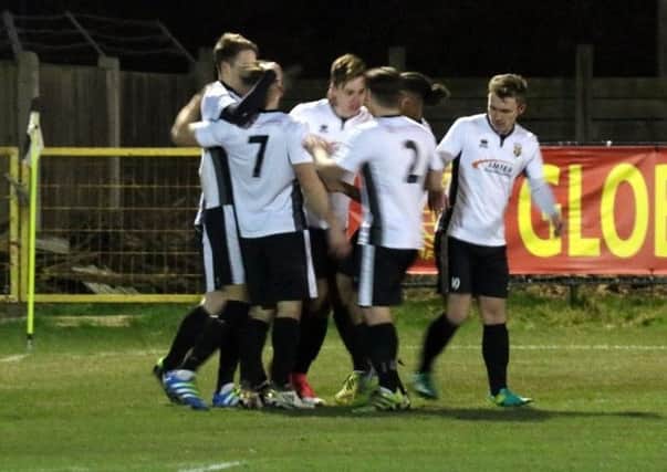 Pagham celebrate a goal against Horsham / Picture by Roger Smith