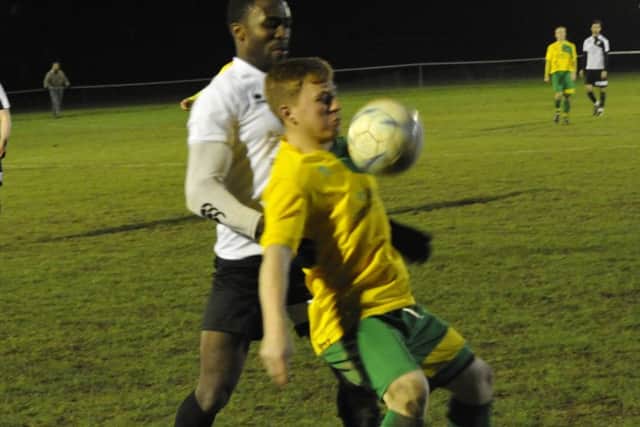 Bexhill wide player Georges Gouet in the thick of the action.