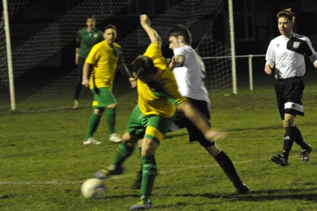 Connor Robertson tussles for possession at The Polegrove last night.