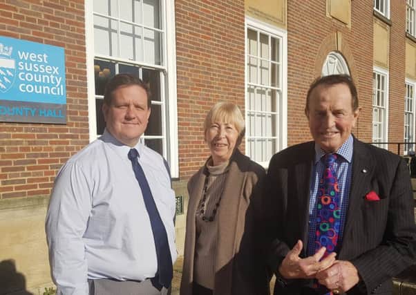 Lib Dems Daniel Purchese, Morwen Millson, and James Walsh outside County Hall. They succesfully persuaded committee members to call for the Tory-led West Sussex County Council to pause a new crowdfunding model for community projects.