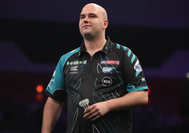 Rob Cross on stage during his 7-1 defeat to Simon Whitlock in Cardiff tonight. Picture courtesy Lawrence Lustig/PDC