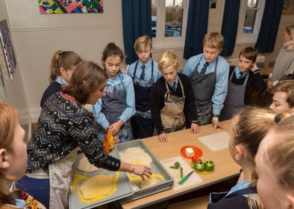 Pupils learn how to make pizza