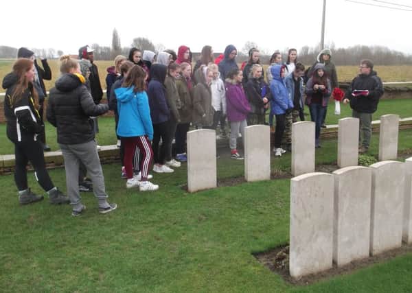 Pupils and staff laid poppies on the graves in the war cemeteries