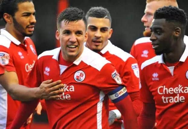 Crawley Town players celebrate their first goal scored by Jimmy Smith.
Picture by Steve Robards