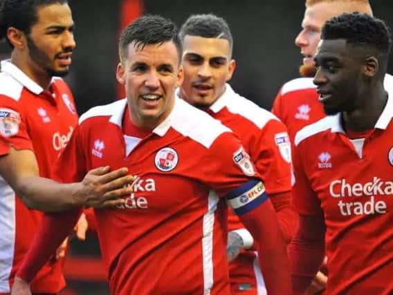 Crawley Town players celebrate their first goal scored by Jimmy Smith.
Picture by Steve Robards