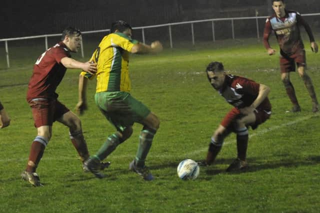 James Maynard and Harry Saville close down a Hailsham Town opponent at the end of January.
