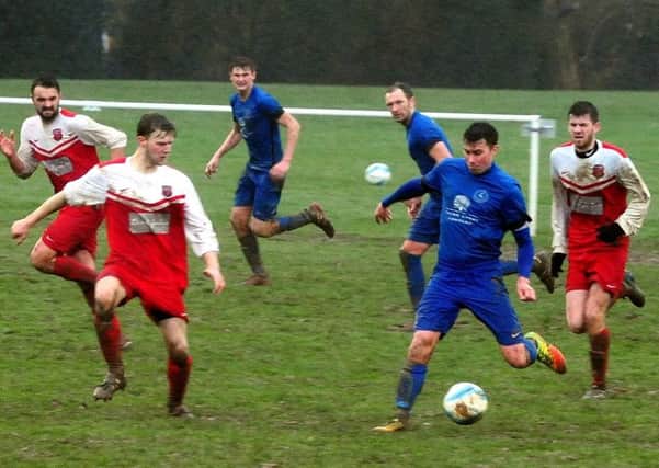 Lewis Hamilton in action in Midhurst's win over Seaford / Picture by Kate Shemilt