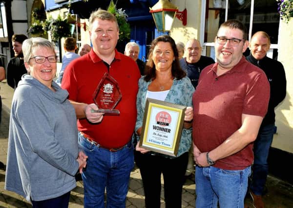 The Kings Head at Billingshurst is named Pub of the Year. Owners Colin and Oonagh Ganley (centreof pic). Pic SR 1803407 Pic Steve Robards SUS-180130-164823001