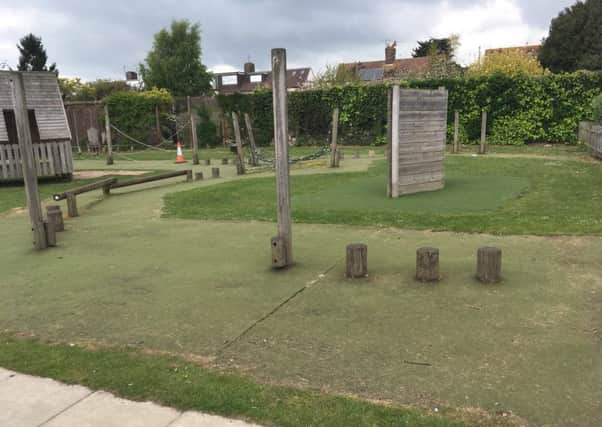 The surface around the play equipment at Buckingham Park Primary School is currently a mixture of carpet, grass and exposed earth and stone, which is incredibly worn