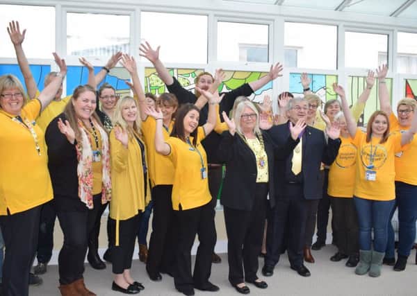 Hastings Mayor, Cllr Judy Rogers and Deputy Mayor Nigel Sinden, join St MichaelÂ’s Hospice staff and volunteers to celebrate Yellow Week SUS-180214-094931001