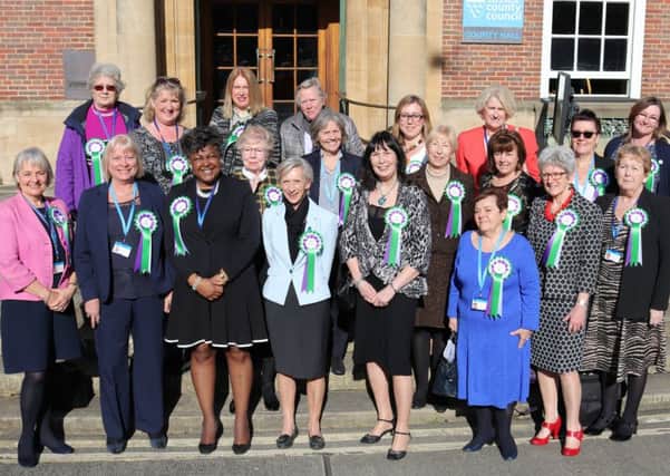 Female members of the county council wearing suffragette rosettes. Picture: WSCC