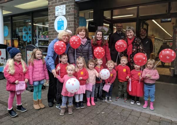 Children and staff from St Andrew's Pre-School in Steyning at The Co-op for the Valentine's fundraising event