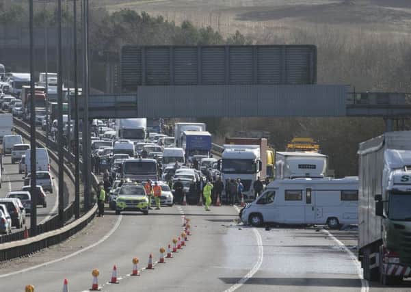 The M23 was closed following an eight-car crash