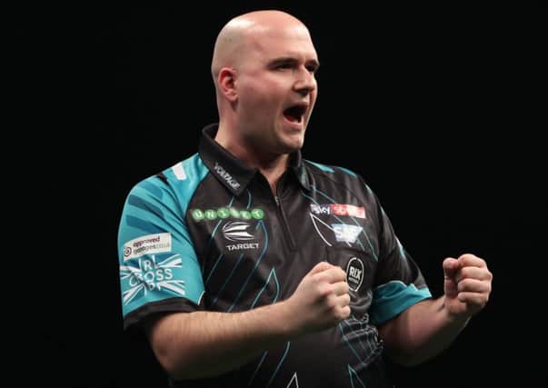 Rob Cross celebrates during his 7-4 victory over Peter Wright. Picture courtesy Lawrence Lustig/PDC