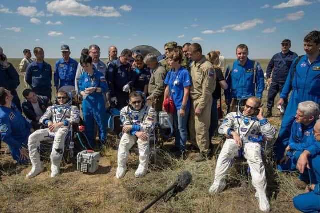 Tim Peake (left) after landing safely back on Earth with fellow astronauts Yuri Malenchenko and Tim Kopra. Picture: NASA/Bill Ingalls