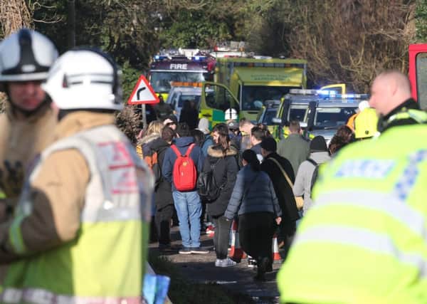Passengers and emergency services at the scene