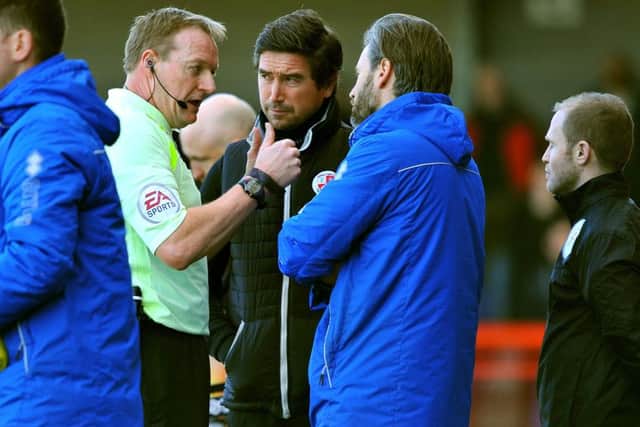 Crawley Town FC v Lincoln City FC. Ref informed about issue in dug out by fourth official 1st half. Pic Steve Robards SR1804949 SUS-180217-163848001