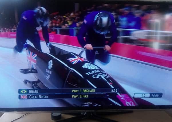 Team GB pilot and former Crawley AC decathlete Brad Hall, right, in action with Joel Fearon compete in heat one of the Two-Man Bobsleigh event held at the Sliding Centre at PyeongChang in South Korea.
Picture by Graham Carter SUS-180218-130601002